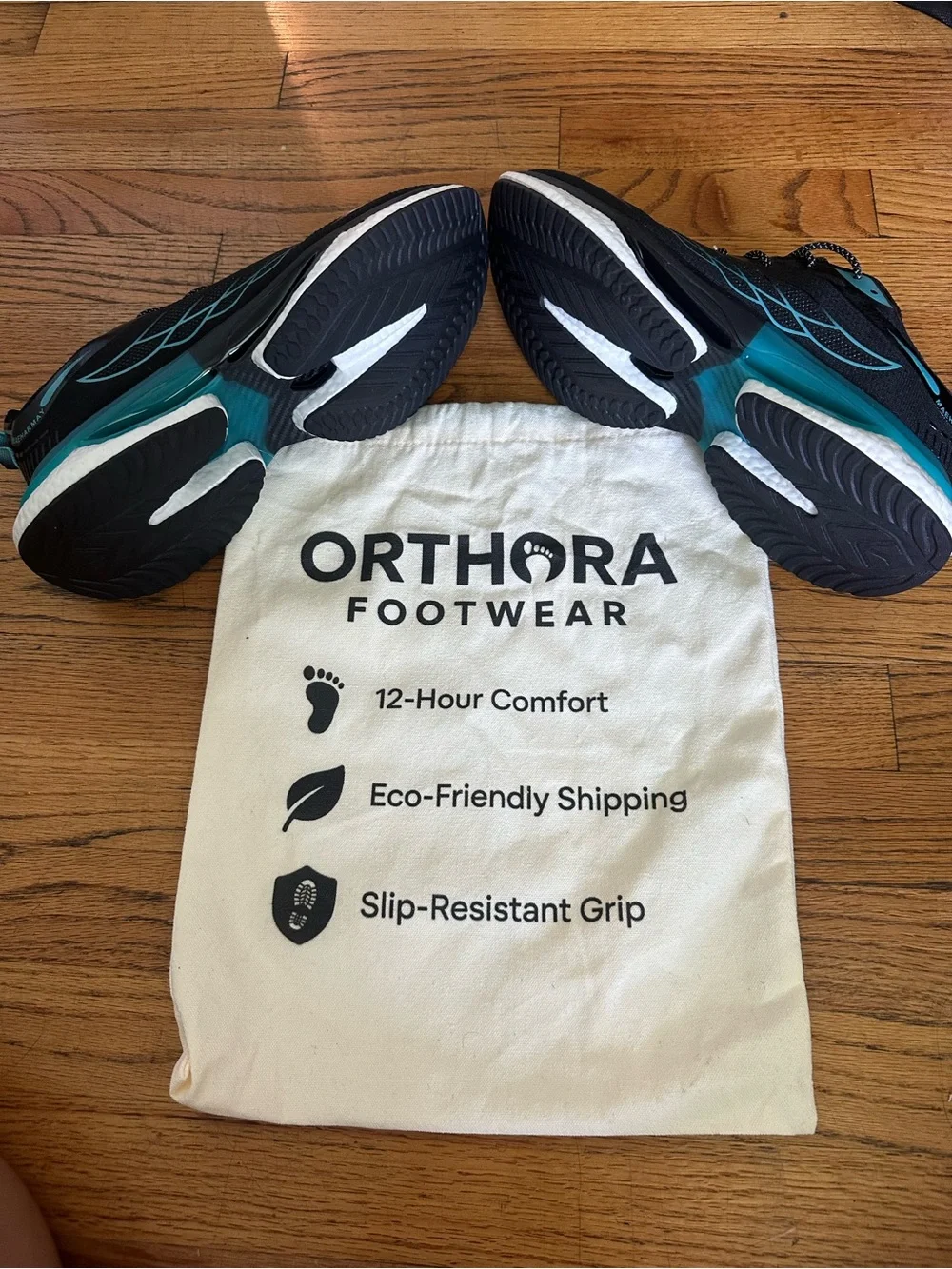 Orthora Black Sneakers with Teal Accents